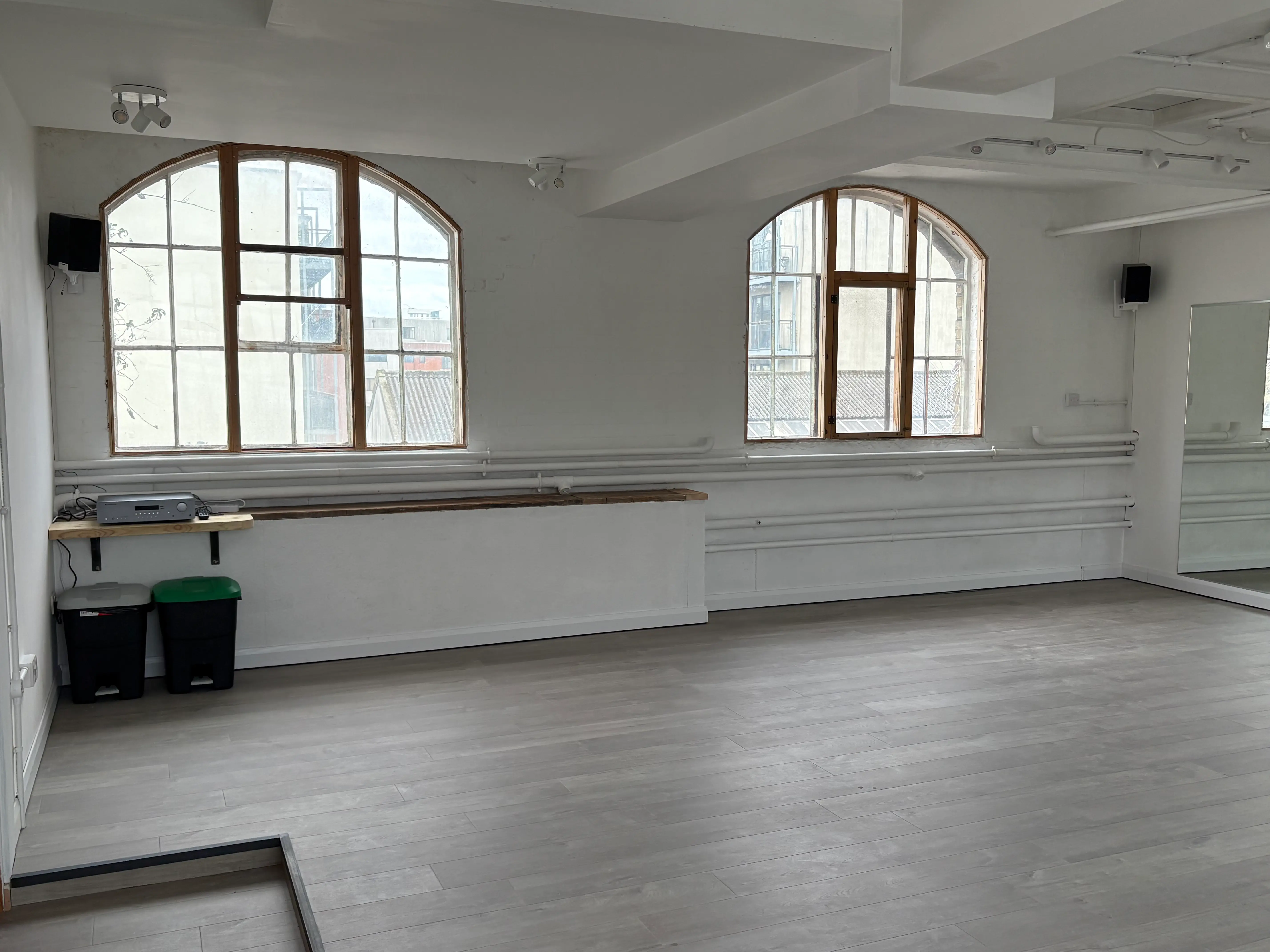 Studio 49 — Victorian warehouse interior with arched windows and sprung floor